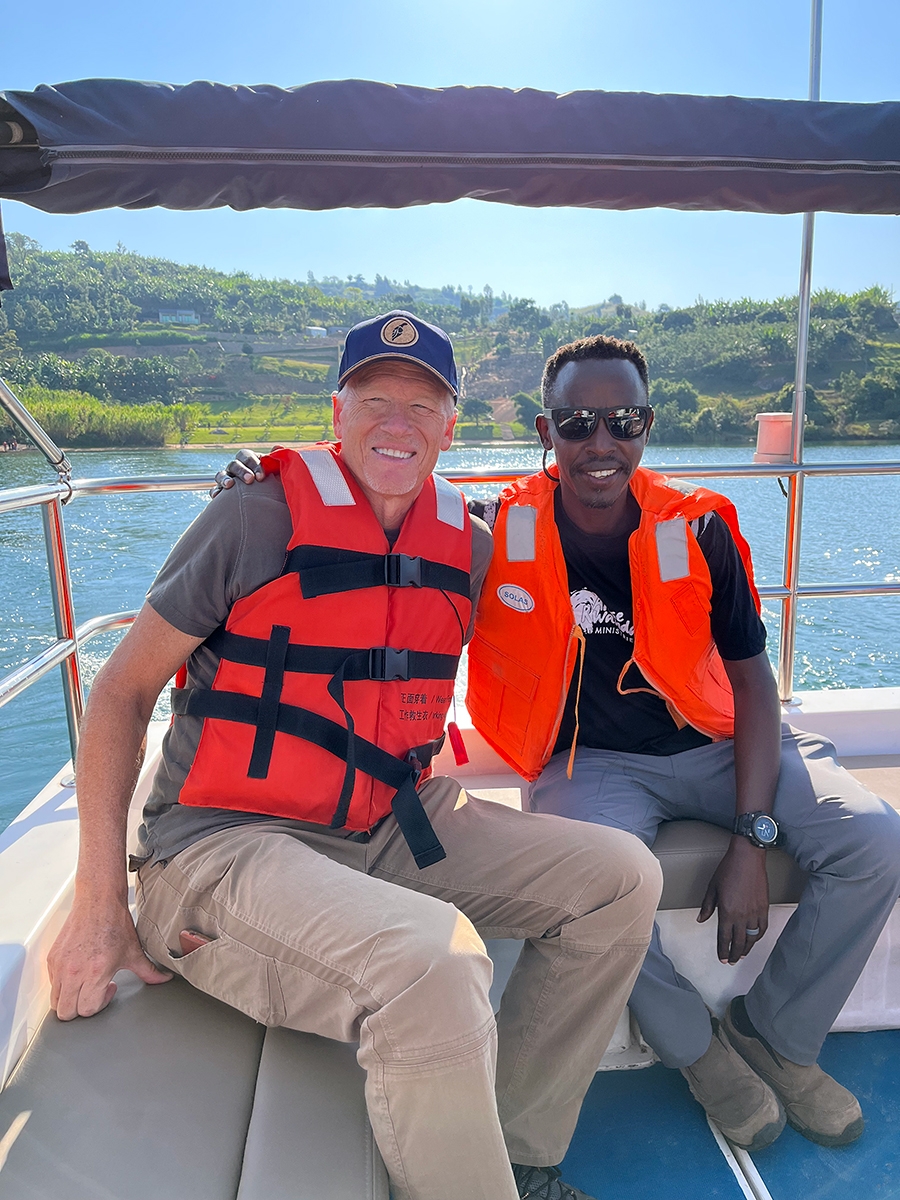 Greg and John ride in a boat to Iwawa Island